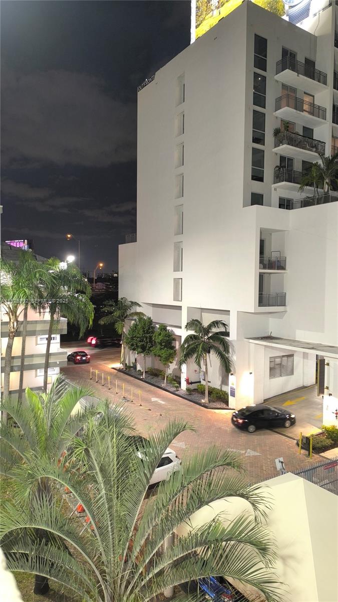 a swimming pool with outdoor seating and yard