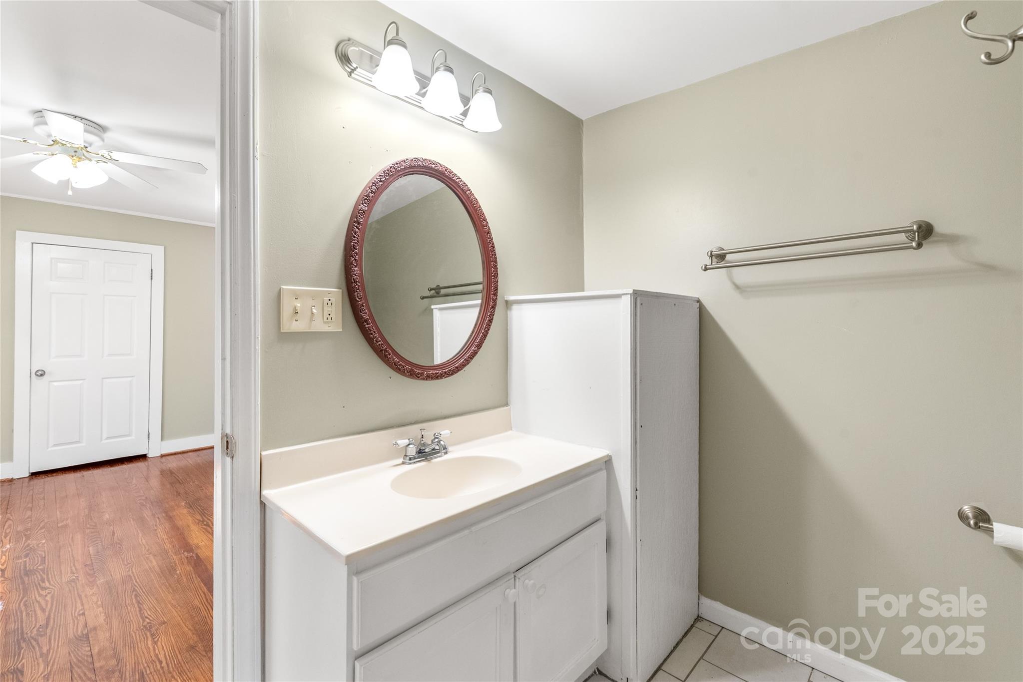 1914 John Moore Road Monroe, NC 28110 - Photo 21 of 27 a bathroom with a sink and a mirror