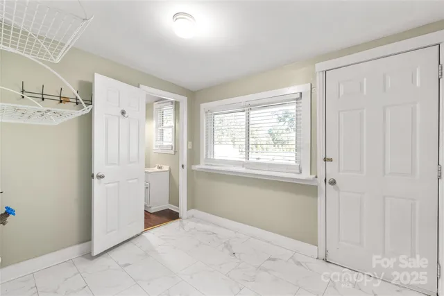 a view of a hallway with a bathroom