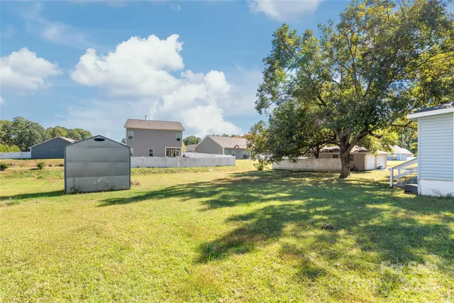 a view of a house with a big yard