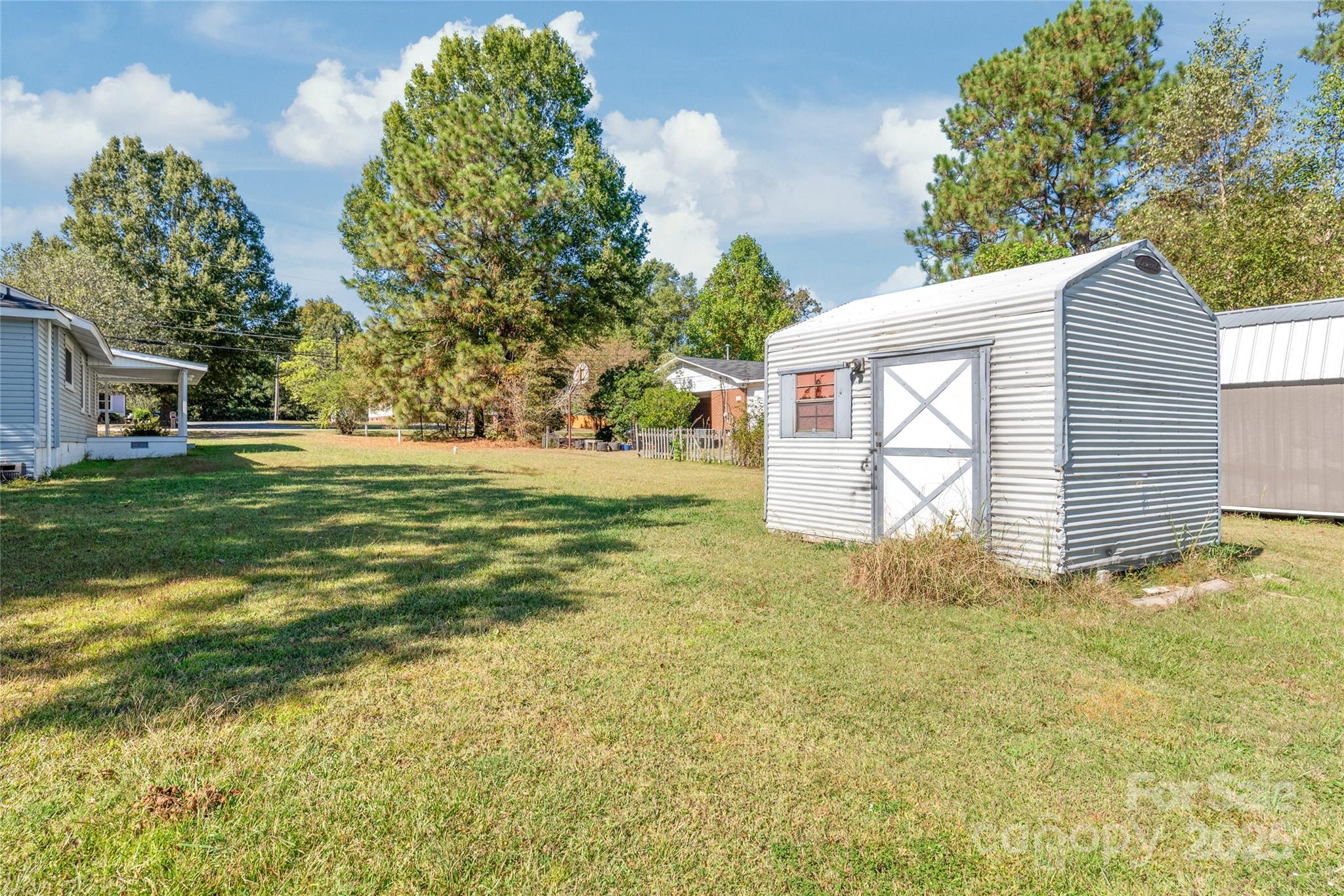 1914 John Moore Road Monroe, NC 28110 - Photo 27 of 27 a view of a backyard with large trees