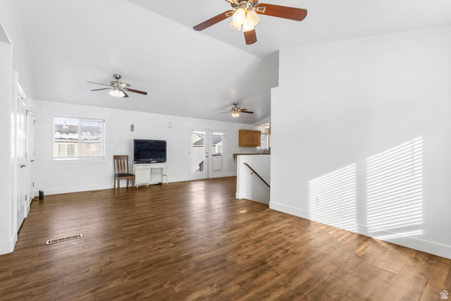 1468 South 910 West Payson, UT 84651 - Photo 4 of 25 Unfurnished living room featuring dark wood-style floors and vaulted ceiling