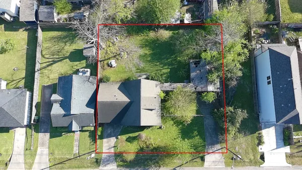 an aerial view of houses with yard