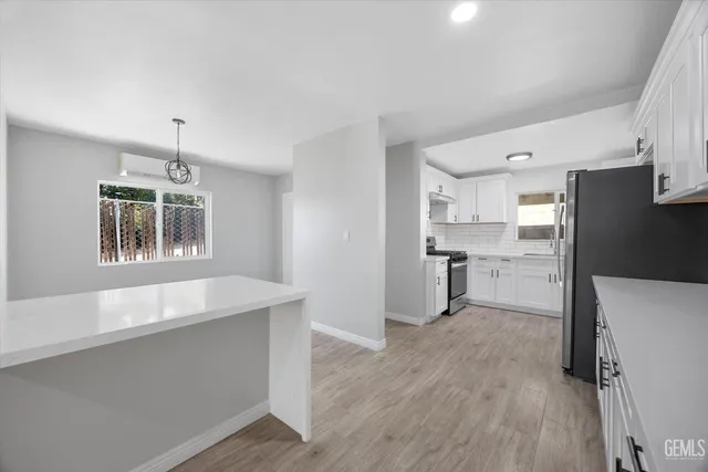 a view of hallway with wooden floor