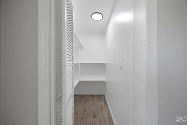 a bathroom with a bathtub sink and mirror