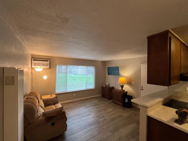 a living room with furniture and a large window