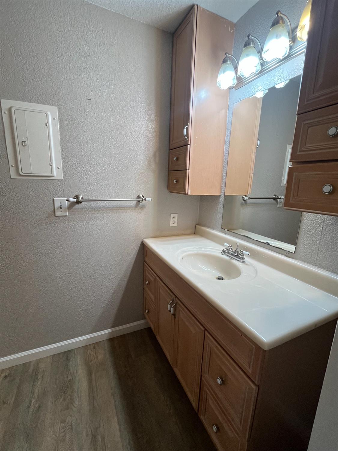 6724 Plymouth Road, Unit 33 Stockton, CA 95207 - Photo 9 of 12 a bathroom with a sink vanity and a mirror