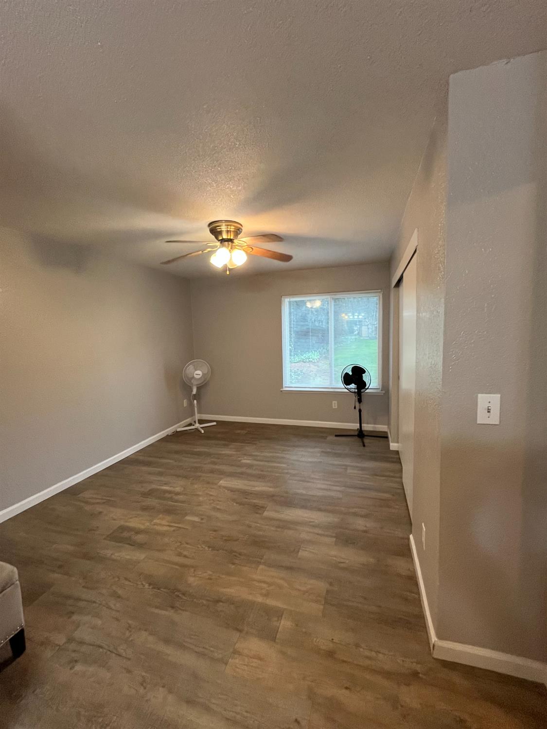 6724 Plymouth Road, Unit 33 Stockton, CA 95207 - Photo 10 of 12 a view of a room with wooden floor