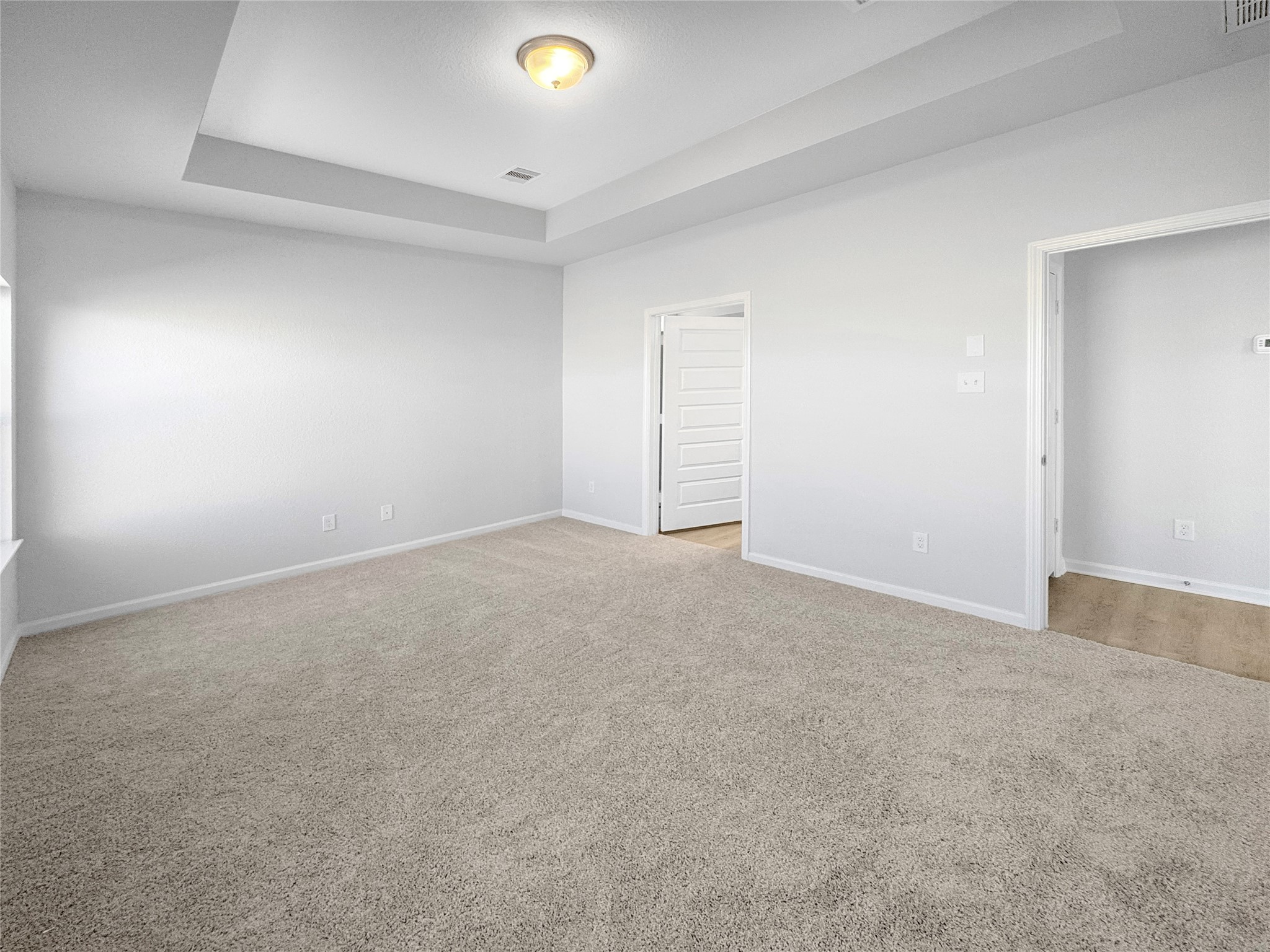 1941 North Riverside Circle Dayton, TX 77535 - Photo 7 of 27 The Waring III-Primary Suite, Tray Ceiling not included. Under construction, options, upgrades and colors will vary.