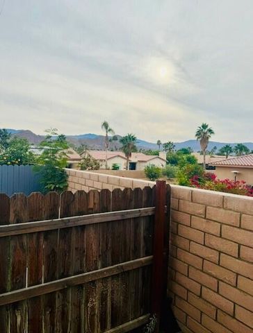 a view of a balcony with wooden floor and outdoor space