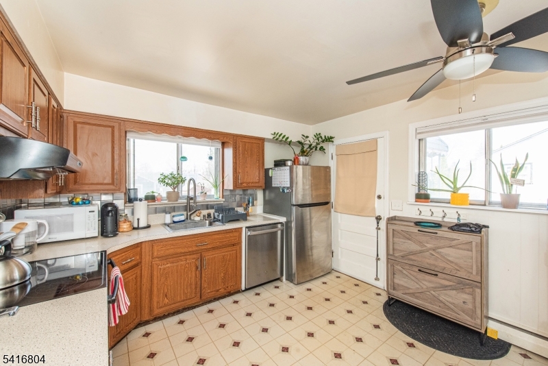 26 Green Road Mine Hill, NJ 07803 - Photo 14 of 21 a kitchen with a sink stove and refrigerator