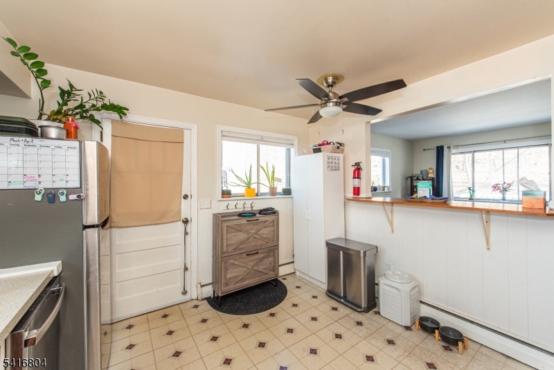26 Green Road Mine Hill, NJ 07803 - Photo 16 of 21 a kitchen with stainless steel appliances a refrigerator and a stove top oven