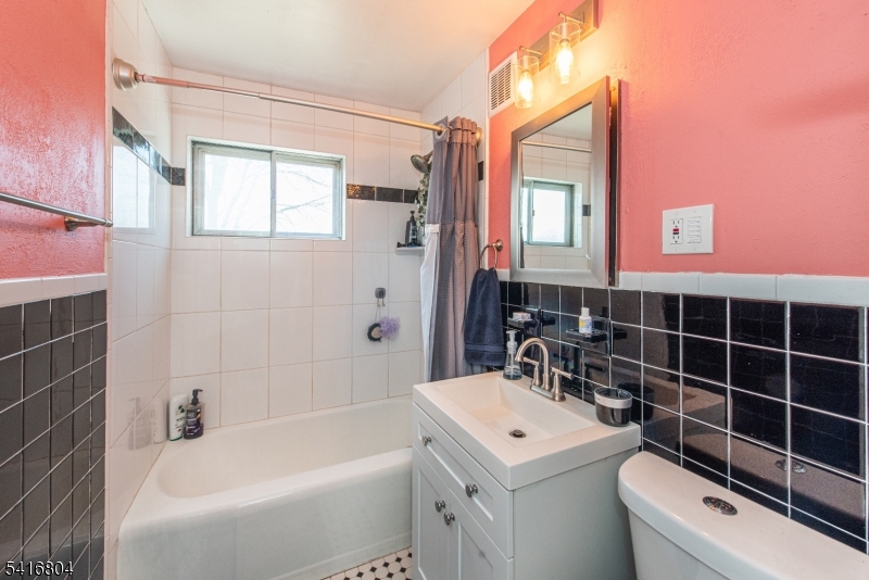 26 Green Road Mine Hill, NJ 07803 - Photo 19 of 21 a bathroom with a sink toilet vanity and tub