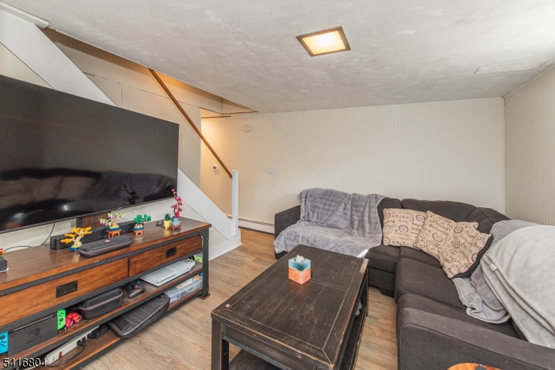 26 Green Road Mine Hill, NJ 07803 - Photo 20 of 21 a living room with furniture and a wooden floor