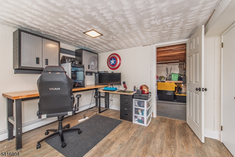 26 Green Road Mine Hill, NJ 07803 - Photo 21 of 21 a view of a workspace with furniture and a window