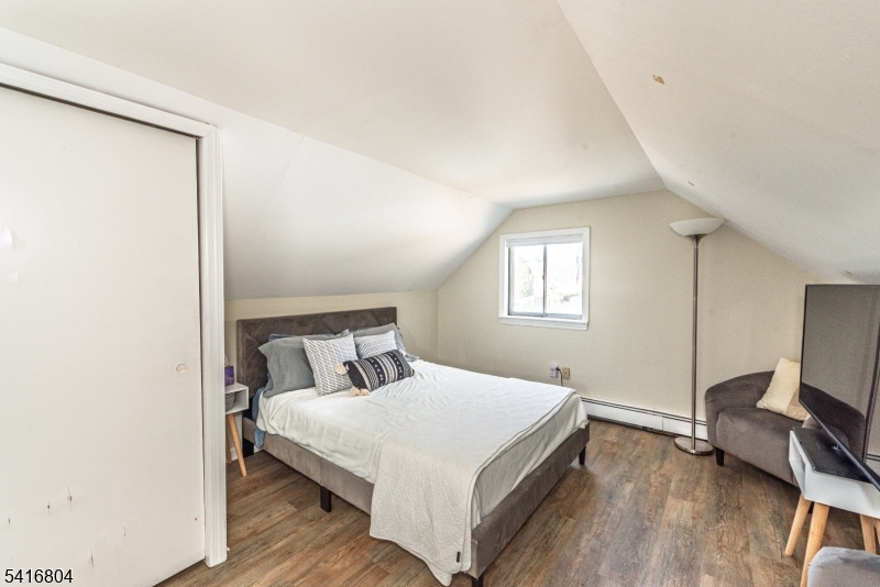 26 Green Road Mine Hill, NJ 07803 - Photo 9 of 21 a bedroom with a bed and a flat screen tv