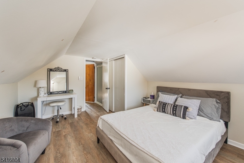 26 Green Road Mine Hill, NJ 07803 - Photo 10 of 21 a bedroom with a large bed and wooden floor