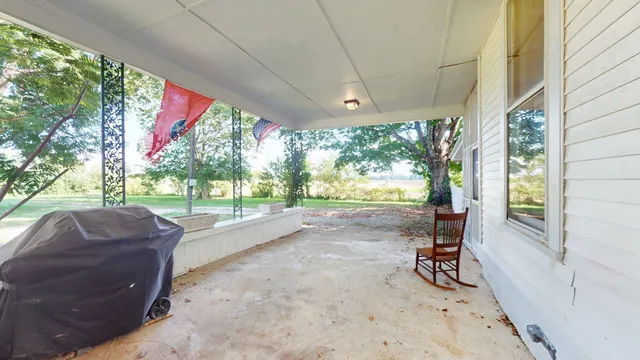 a house view with a sitting space and garden