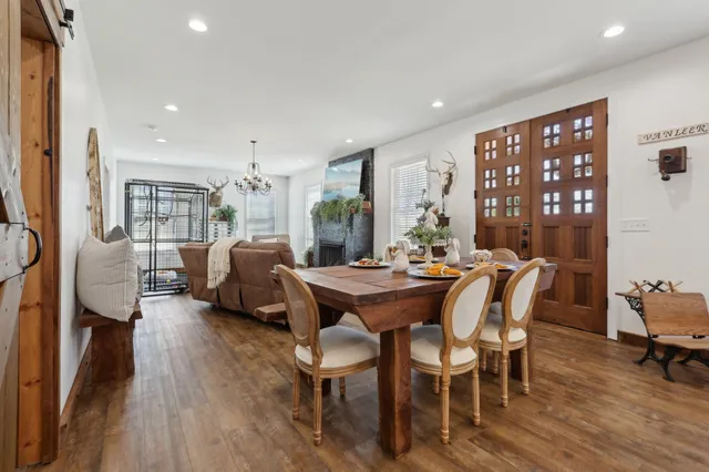 a view of a dining room with furniture window and wooden floor