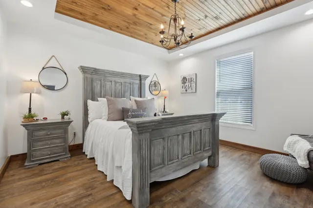 a bedroom with bed and window