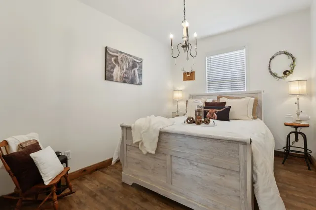 a bedroom with bed and window