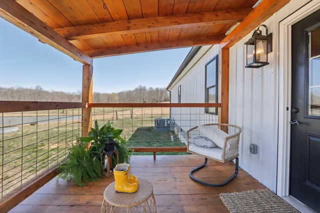 a view of swimming pool with sitting area