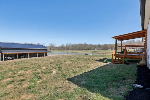 view of living room with a large window and wooden floor