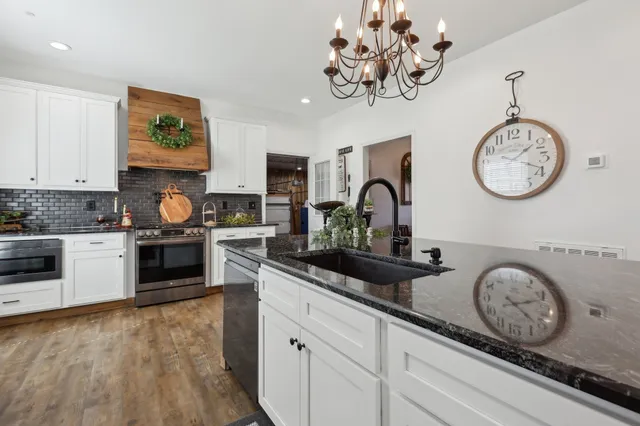 a kitchen with cabinets and window