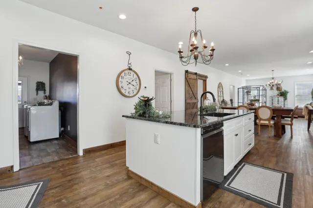 a kitchen with stove and cabinets