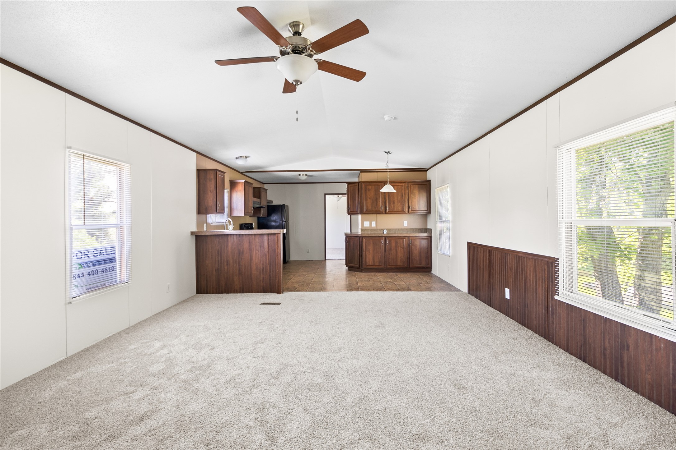 443 West Lone Oak Road Onalaska, TX 77360 - Photo 4 of 21 an empty room with window and cabinet