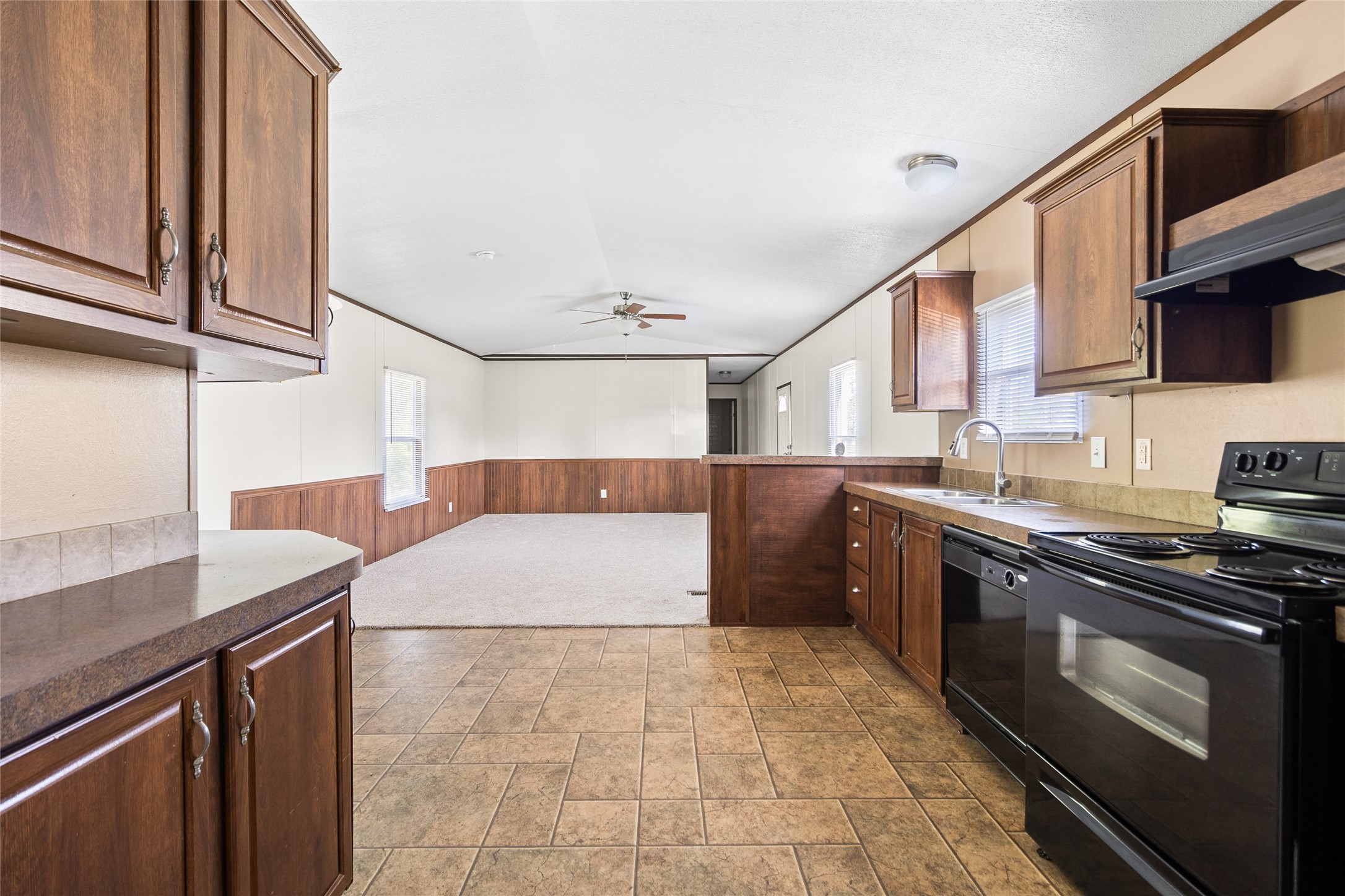 443 West Lone Oak Road Onalaska, TX 77360 - Photo 6 of 21 a kitchen with stainless steel appliances granite countertop a sink and a stove