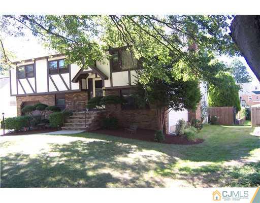 69 Morningside Road Colonia, NJ 07067 - Photo 1 of 25 a view of a yard with a house