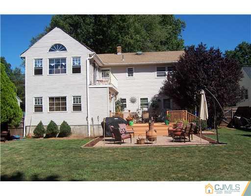 69 Morningside Road Colonia, NJ 07067 - Photo 2 of 25 a view of a house with backyard sitting area and garden