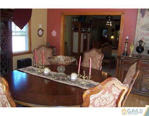 69 Morningside Road Colonia, NJ 07067 - Photo 11 of 25 a dining room with table and chairs