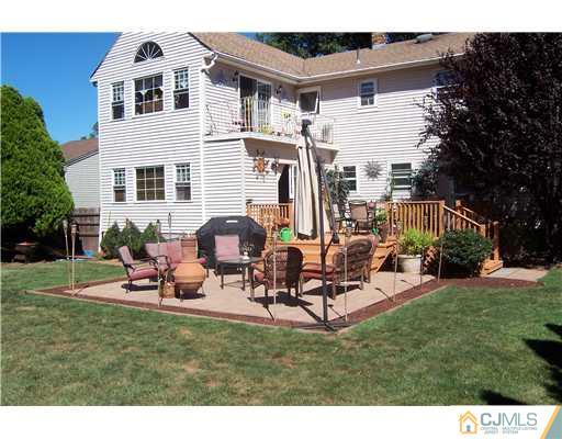 69 Morningside Road Colonia, NJ 07067 - Photo 23 of 25 a view of a house with backyard and sitting area