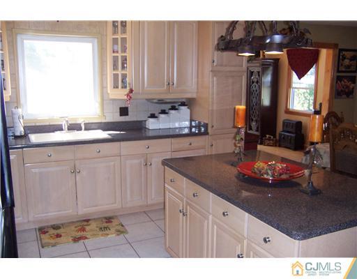 69 Morningside Road Colonia, NJ 07067 - Photo 4 of 25 a kitchen with sink and cabinets