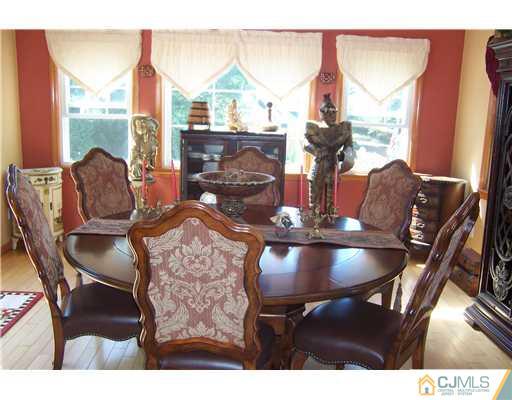 69 Morningside Road Colonia, NJ 07067 - Photo 10 of 25 a dining room with furniture and wooden floor
