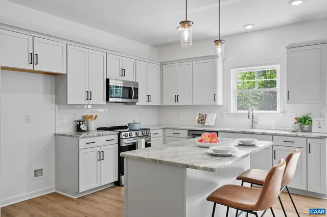 a room with furniture and painting on the wall