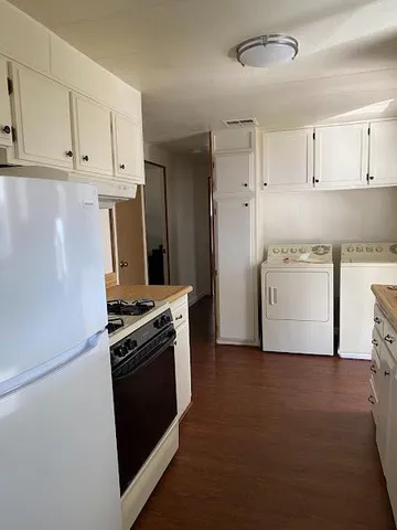 a kitchen with a stove and a refrigerator