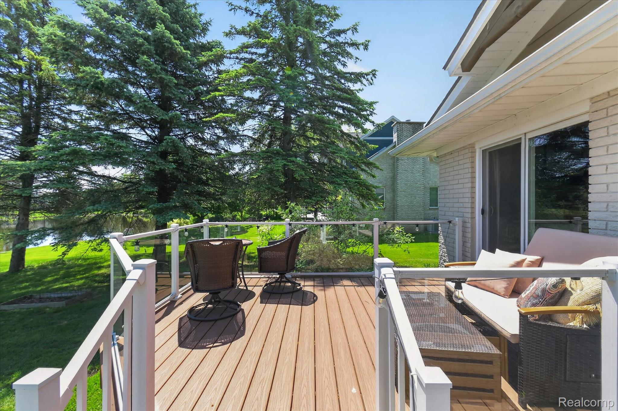 3860 East Commerce Road Commerce Township, MI 48382 - Photo 45 of 72 Expansive outdoor deck featuring wood-finish flooring and a glass panel railing system