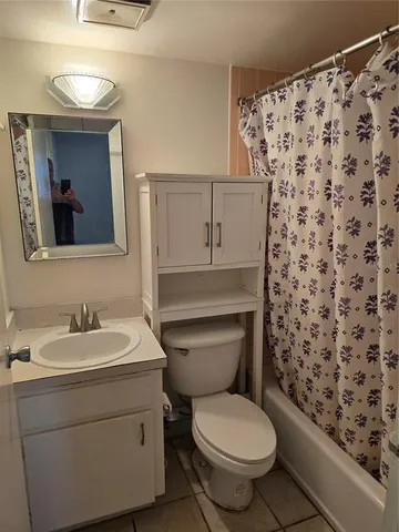 a bathroom with a toilet and a sink