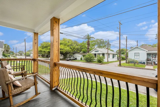a view of a balcony with chairs