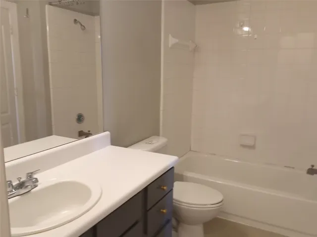 a bathroom with a sink toilet and a bathtub