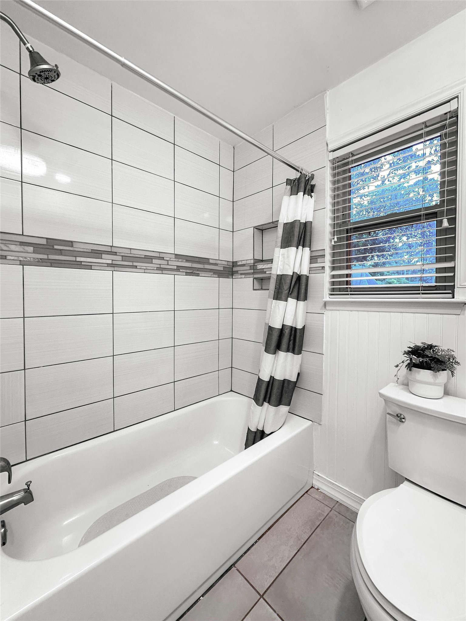6511 Castle Pine Lane Spring, TX 77379 - Photo 34 of 49 Well-appointed bathroom showcasing tiled shower surround details, functional layout, and timeless finishes designed for everyday convenience.