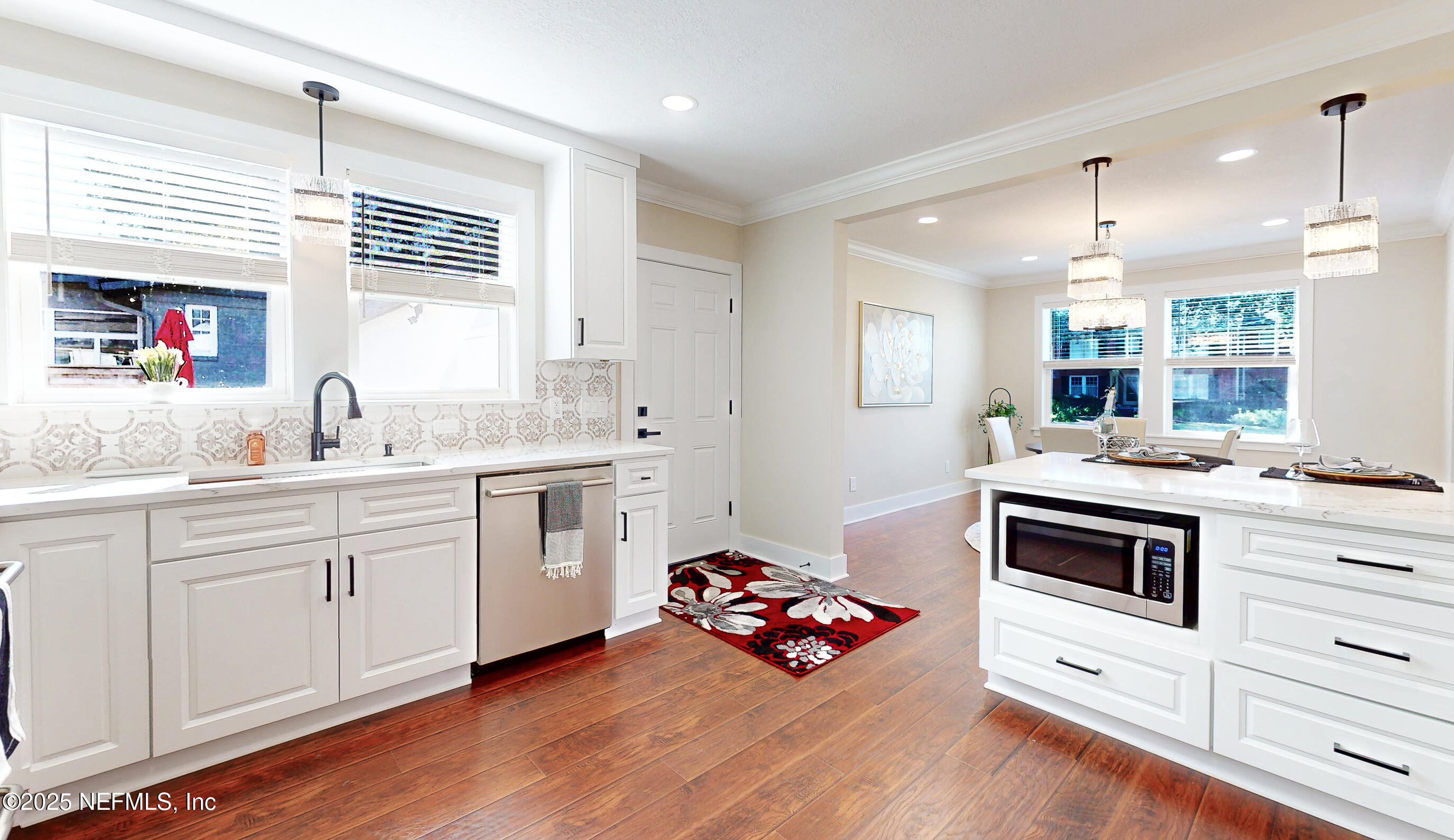 1153 Monticello Road Jacksonville, FL 32207 - Photo 12 of 37 a kitchen with a sink stove and cabinets
