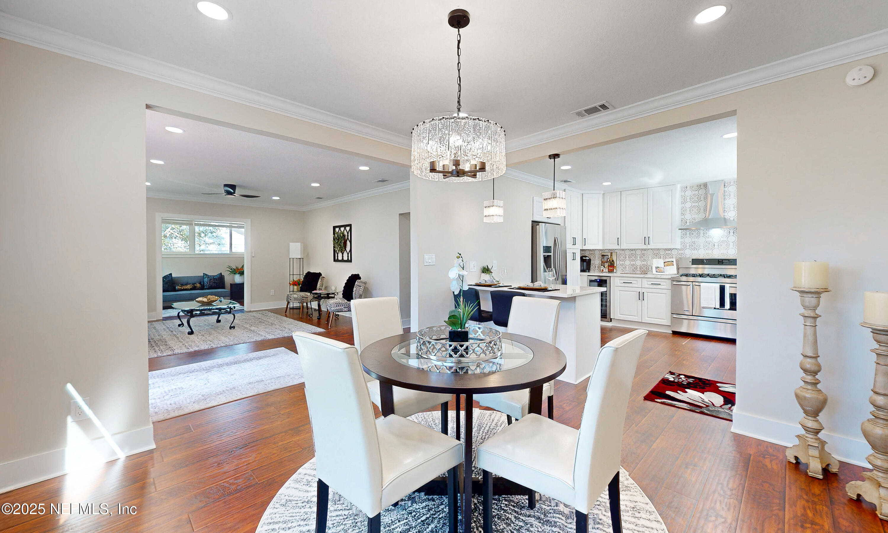 1153 Monticello Road Jacksonville, FL 32207 - Photo 15 of 37 a view of a dining room with furniture and wooden floor