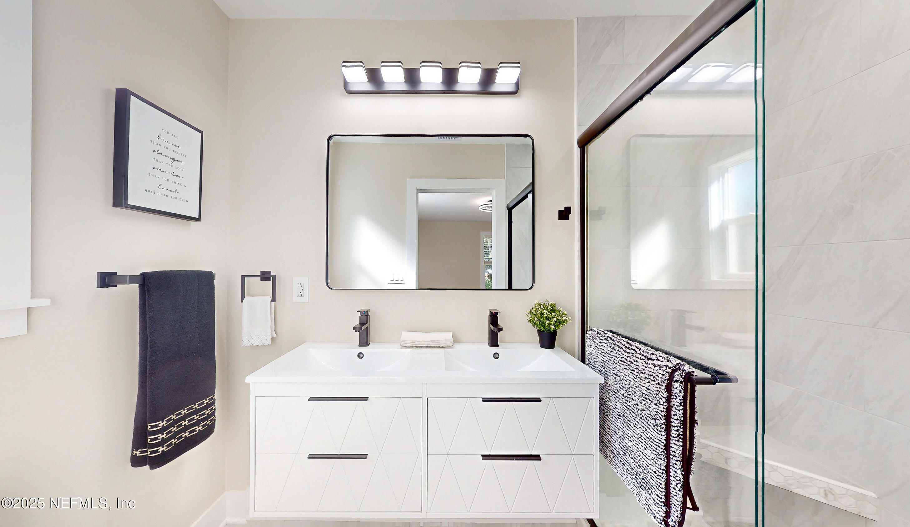 1153 Monticello Road Jacksonville, FL 32207 - Photo 18 of 37 a bathroom with a sink vanity and a mirror