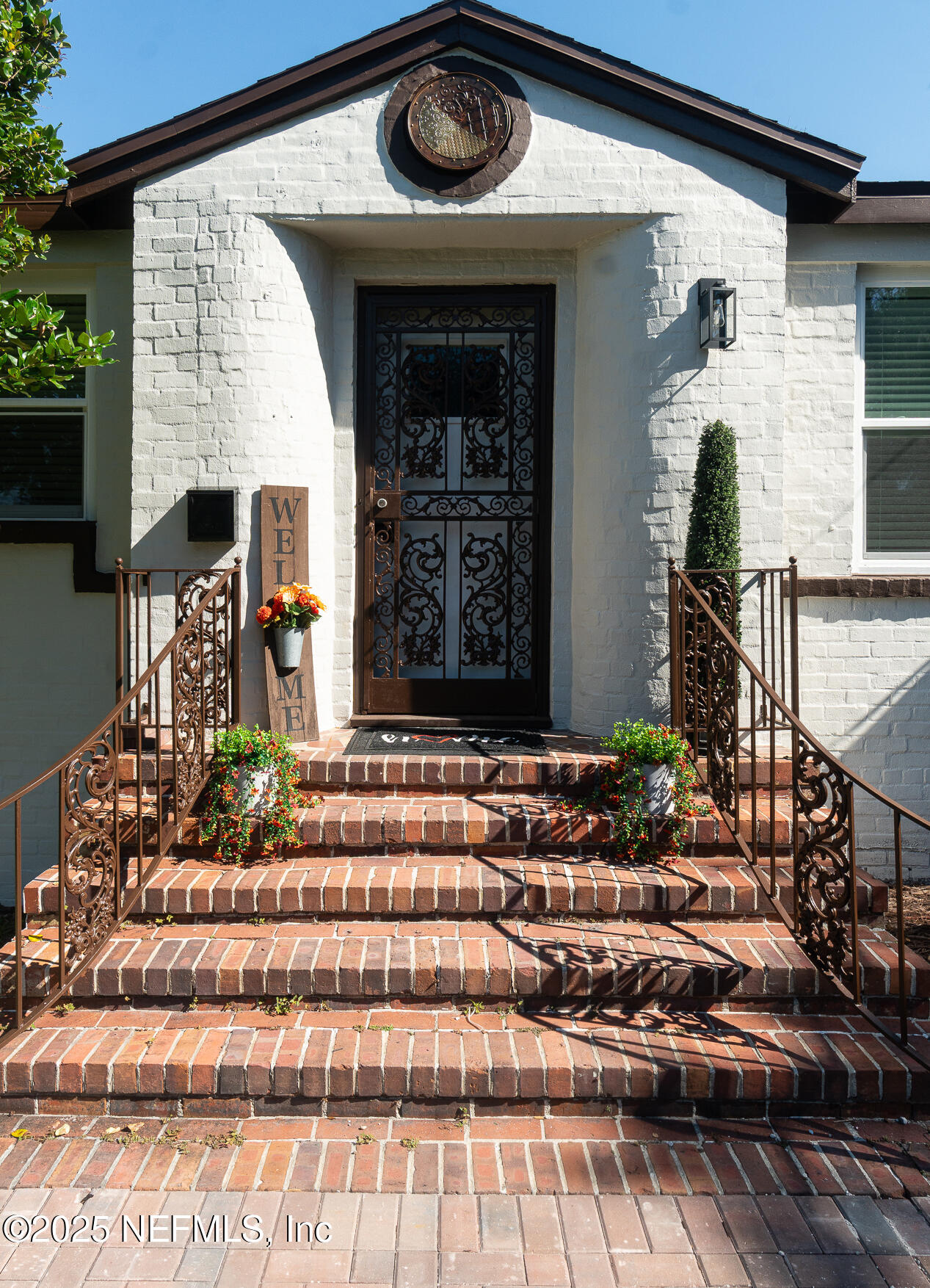 1153 Monticello Road Jacksonville, FL 32207 - Photo 2 of 37 a front view of a house with garden