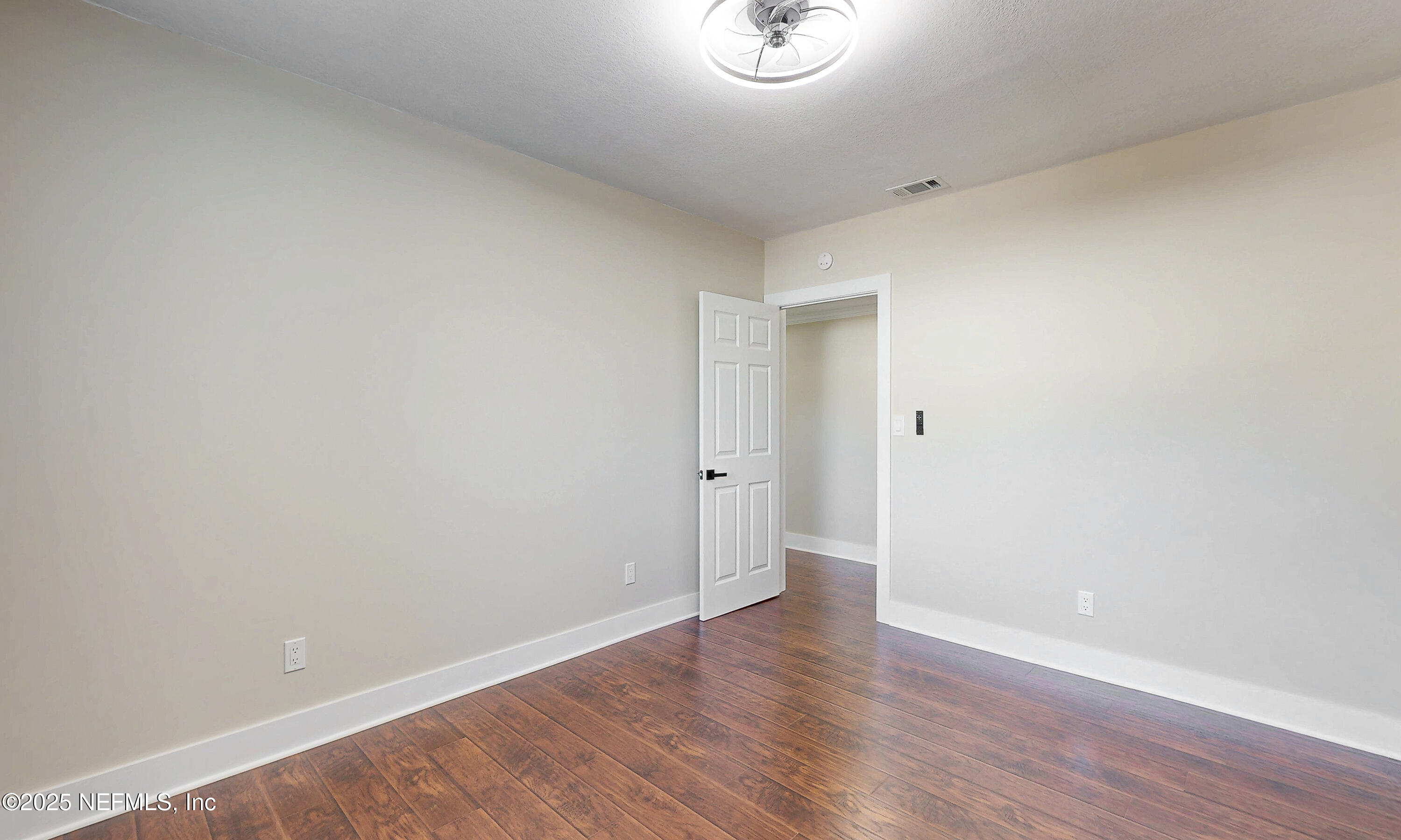 1153 Monticello Road Jacksonville, FL 32207 - Photo 21 of 37 a view of a room with wooden floor