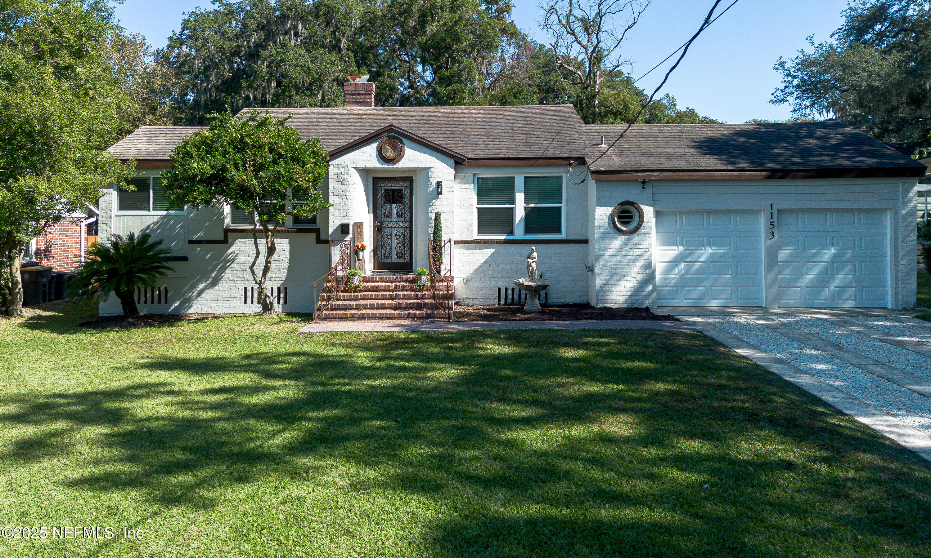 1153 Monticello Road Jacksonville, FL 32207 - Photo 30 of 37 a front view of a house with a yard